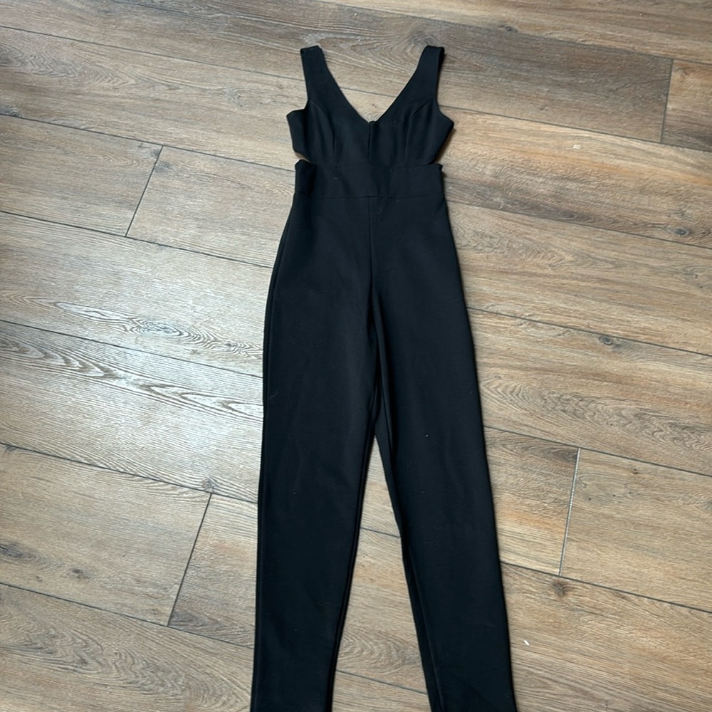 New with Tags (NWT) black jumpsuit/romper - size small.